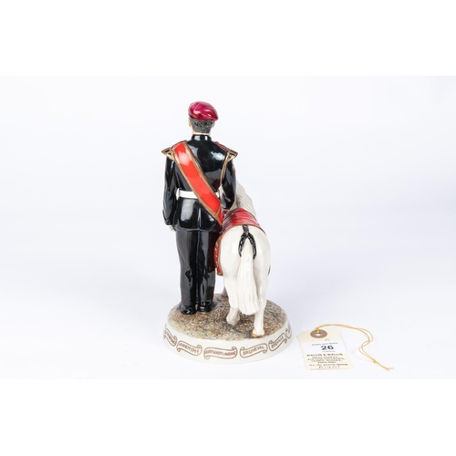 26 - A china figure of a Parachute Regiment Corporal with a pony mascot, 7¾