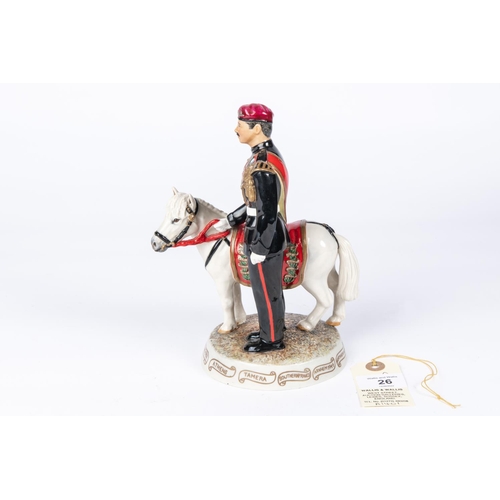 26 - A china figure of a Parachute Regiment Corporal with a pony mascot, 7¾