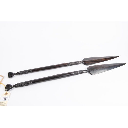 32 - A pair of decorative African short ebony spears, 26