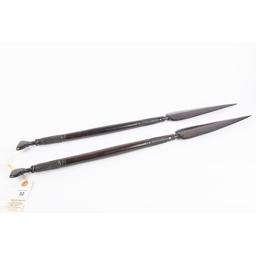 32 - A pair of decorative African short ebony spears, 26