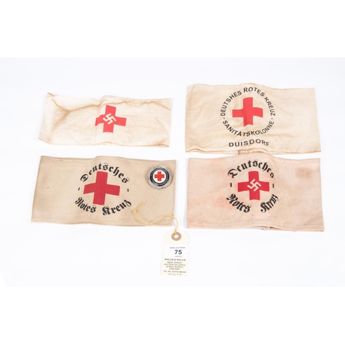 75 - A Third Reich Red Cross arm band, 3 more varying types and an enamel badge. GC £50-60