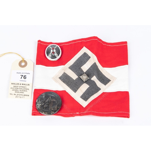 76 - A Third Reich Hitler Youth Armband, a HJ shooting badge and a similar Day badge. GC £50-60