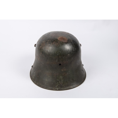 90 - The skull only of a German M1916 steel helmet, reissued during the Third Reich, with applied tri-col... 