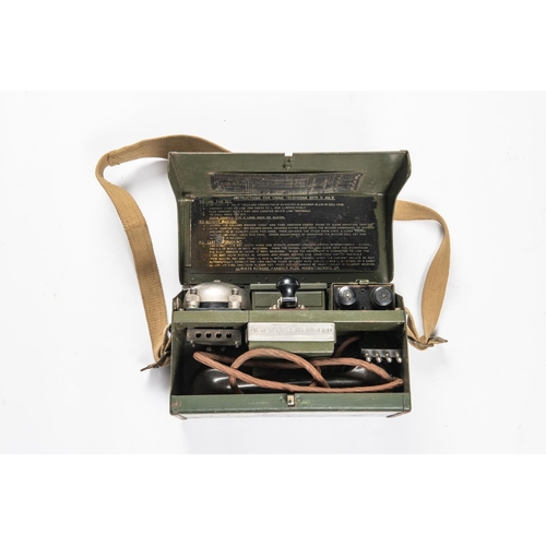 132 - A WWII Field telephone in its case, 