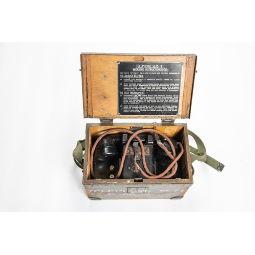 132 - A WWII Field telephone in its case, 