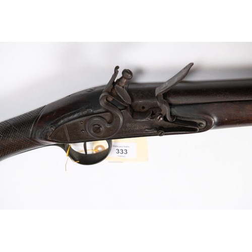 333 - A late 18th century 10 bore flintlock fowling piece, by Hunt of Colchester, barrel 42