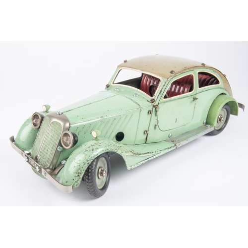 270 - A Marklin clockwork Constructor Car. Bolt together panels in mint green with beige roof and red seat... 