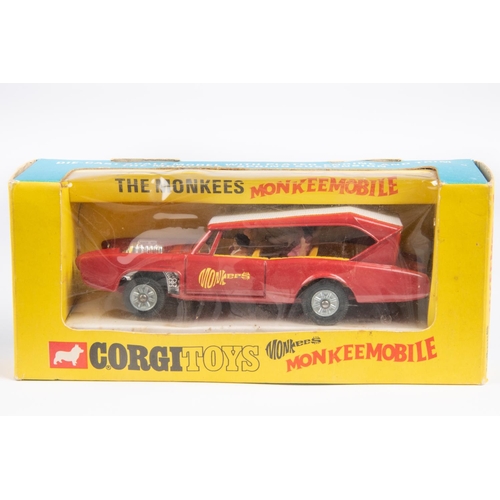 375 - Corgi Toys Monkeemobile (277). The Monkees car in red and white with 4-figures. Boxed with inner tra... 