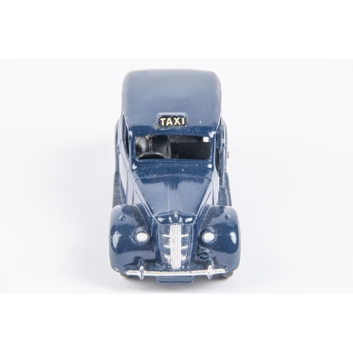 431 - Dinky Toys Taxi (40h). In dark blue with light blue wheels and black chassis. VGC, a few minor chips... 