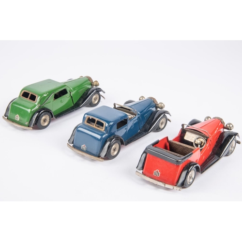 484 - 3 Tri-ang Minic clockwork vehicles. A post war Vauxhall Town Coupe  (18M). In dark blue. A post war ... 