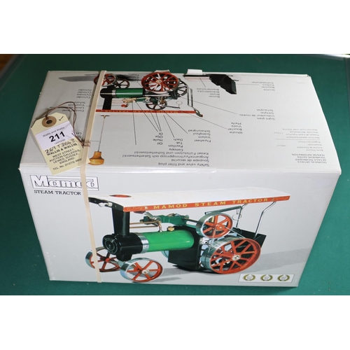 211 - A Mamod live steam Steam Tractor. Traction Engine in green, red and black. Boxed with accessories an... 