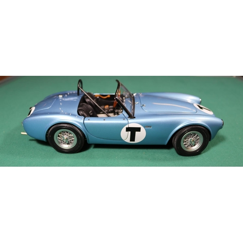 263 - A Racing Legends 1/18 Ford Cobra 260. An example in light metallic blue with black interior, 'T' to ... 