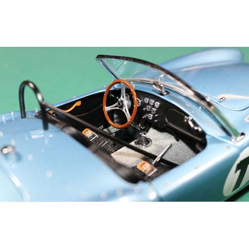 263 - A Racing Legends 1/18 Ford Cobra 260. An example in light metallic blue with black interior, 'T' to ... 