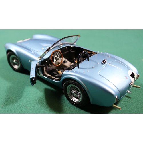 263 - A Racing Legends 1/18 Ford Cobra 260. An example in light metallic blue with black interior, 'T' to ... 