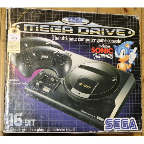 262 - A Sega Mega Drive games console. 16-bit console with 2x controllers. Boxed with inner packing pieces... 