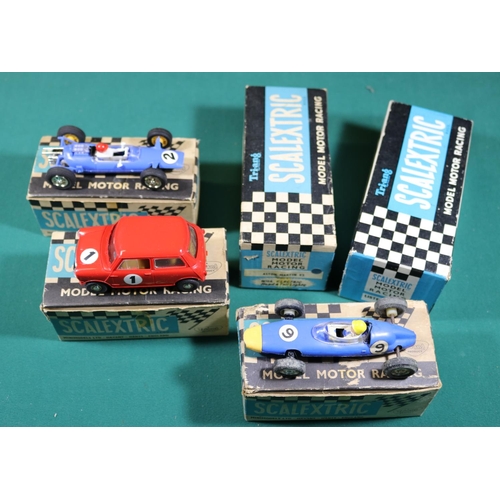 322 - 3x Tri-ang Scalextric cars. (C76) Mini Cooper in red. (C82) Lotus in blue with instructions. (C72) B... 