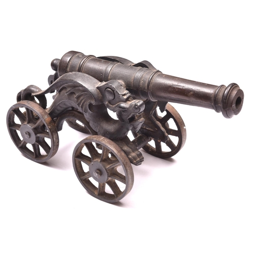 27 - A decorative iron cannon, barrel 15