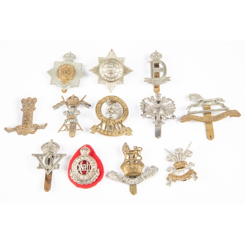 179 - Twelve Cavalry cap badges: KDG (1915-37), chrome plated QDG, 3rd Carabiniers (lugs), 4/7th DG (lugs)... 