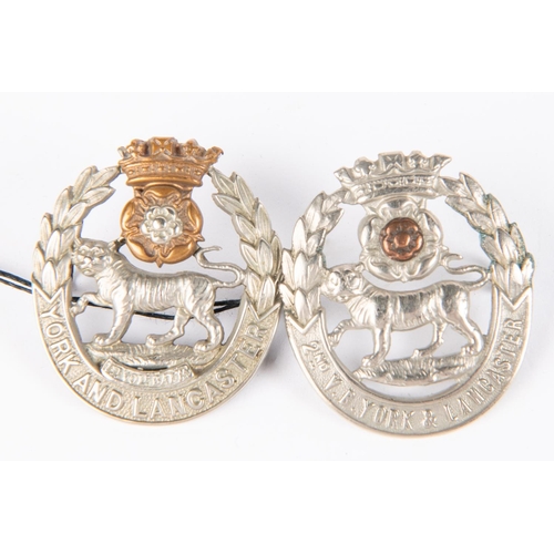 208 - A cap badge of the 1st Vol Bn York and Lancaster Regt, GC; and another similar of the 2nd Vol Bn, (w... 