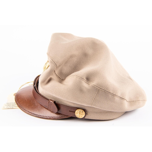 235 - A WWII US Army officer's peaked cap, summer pattern, with gilt badge and buttons; also a modern webb... 