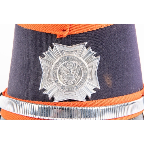 237 - A “United States Veterans of  Foreign Wars” dress band shako, red trimmed blue cloth with red wool p... 