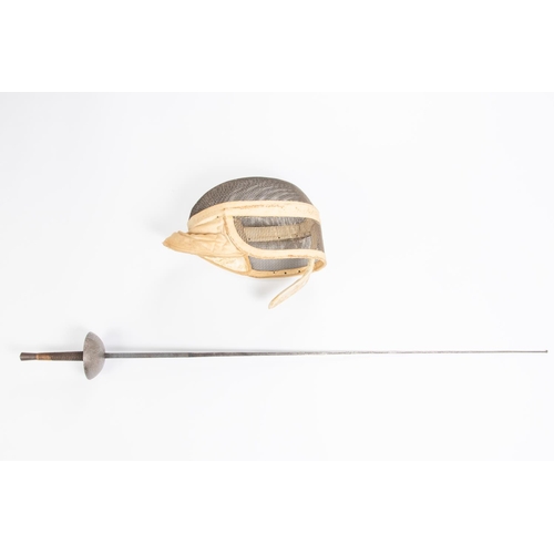 40 - A mesh fencing helmet, probably Inter war vintage; also a foil with etched blade and cup guard. GC £... 