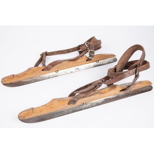 44 - A pair of vintage ice skates, wooden bodies with steel blades marked 