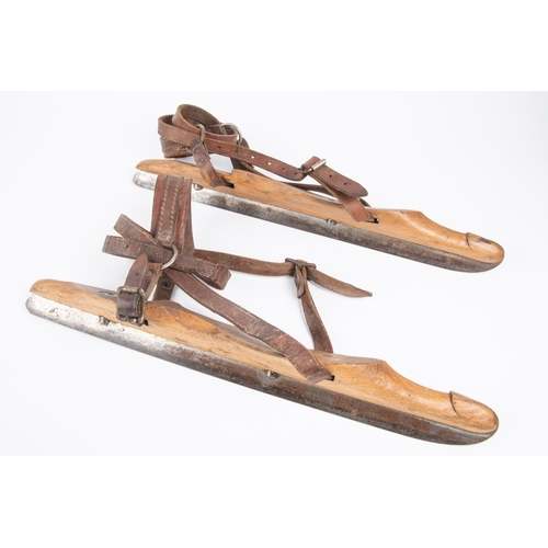 44 - A pair of vintage ice skates, wooden bodies with steel blades marked 