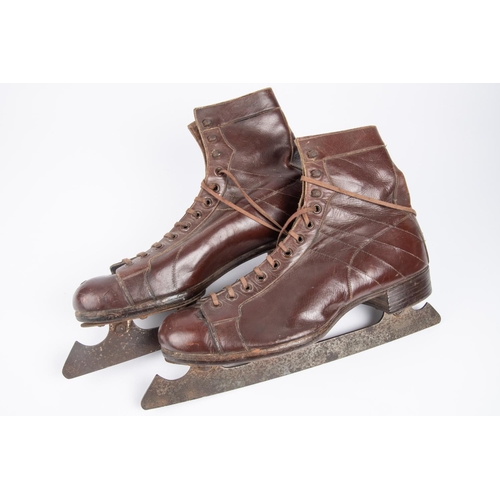 45 - A pair of Embekay vintage ice skating brown leather boots, steel blades marked 