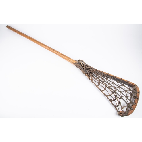 46 - A Victorian wooden lacrosse stick, with leather strapping. GC  £40-50