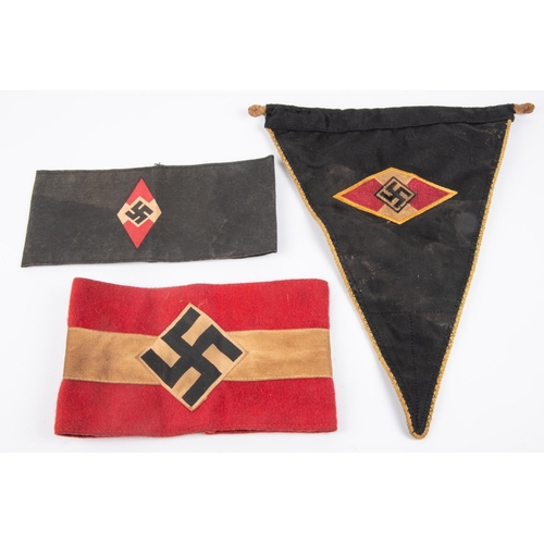 89 - A good quality Third Reich HJ car pennant, black with coloured edging and central motif; a HJ armban... 