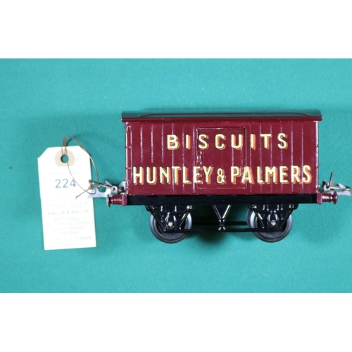 224 - A Hornby Series O gauge Huntley & Palmers Biscuits van in maroon with plastic wheels. VGC, very mino... 