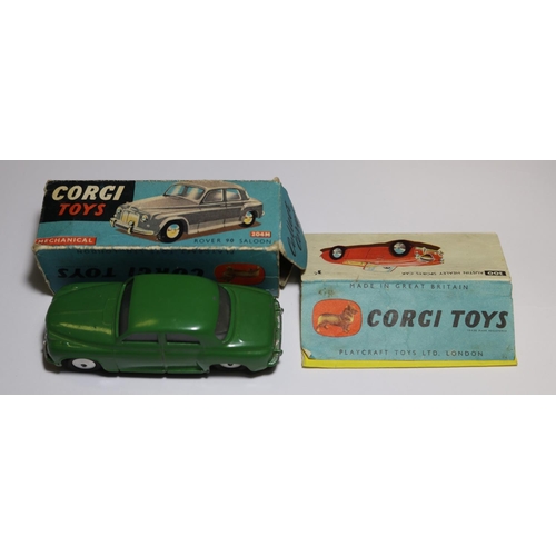 275 - Corgi Toys Rover 90 Saloon (204M). An early mechanical in dark green with a working friction powered... 