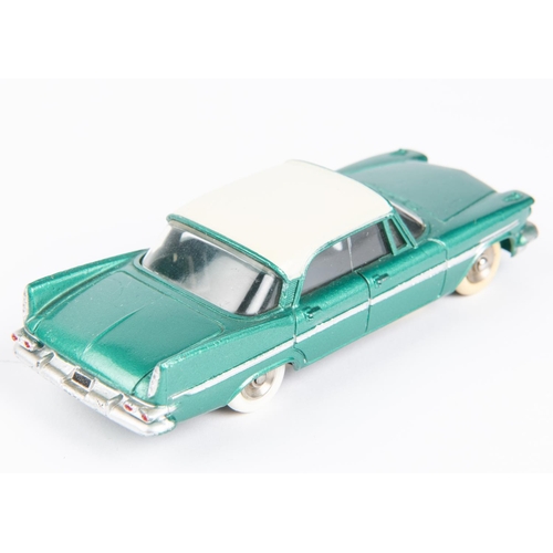 512 - French Dinky Toys De Soto Diplomat (545). A scarce example in metallic green with a cream roof, dish... 