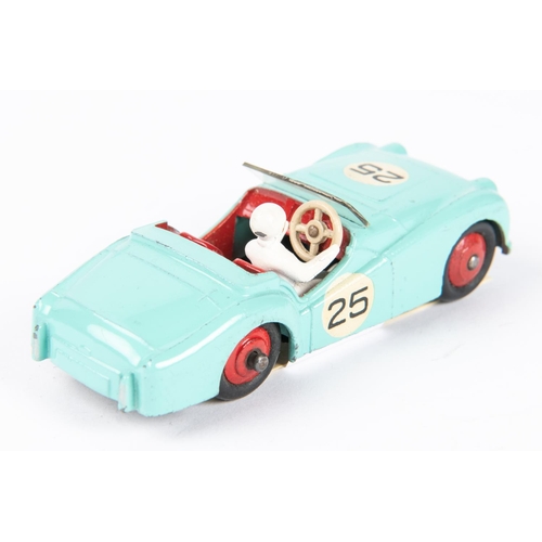 568 - A Dinky Toys Triumph TR2 Sports (111). In turquoise with red interior, red wheels and white driver, ... 