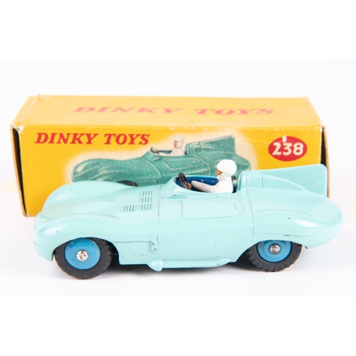 572 - A Dinky Toys Jaguar D-Type Racing Car (238). In turquoise with blue interior, white driver and blue ... 