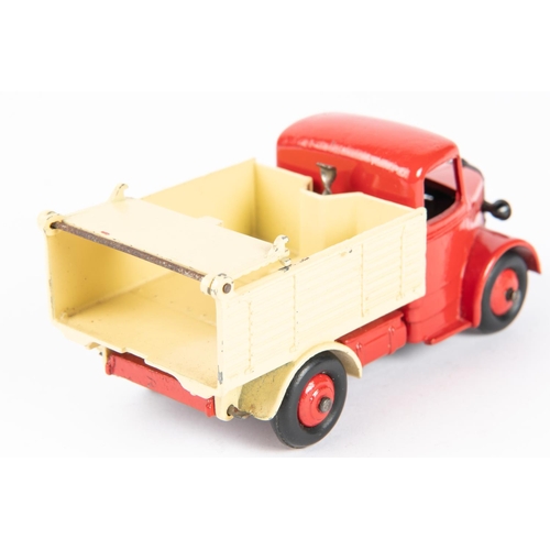 574 - Dinky Toys Bedford End Tipper (410). Red chassis cab with cream body and red wheels. Boxed, some wea... 