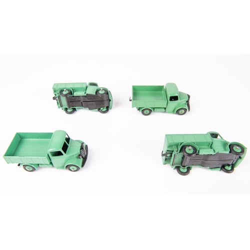 599 - A Dinky Toys Trade Pack of 4 Bedford Trucks (25w). Vehicles with green chassis cab, body and wheels.... 