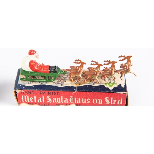 618 - Quantity of mainly Japanese manufacturers, metal Santa Claus on sled, with 8 reindeer in flying posi... 