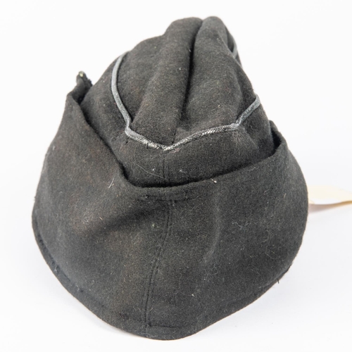 133 - A Third Reich NCO's Panzer side cap, marked inside KDR.Pz. R.G.T. 36, dated 18-1-41. GC  £150-200