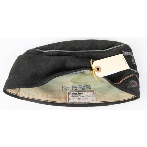 133 - A Third Reich NCO's Panzer side cap, marked inside KDR.Pz. R.G.T. 36, dated 18-1-41. GC  £150-200