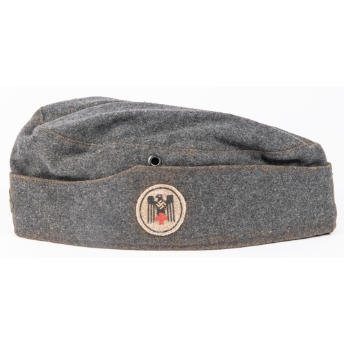 135 - A Third Reich Red Cross Mans side cap, marked in lining 