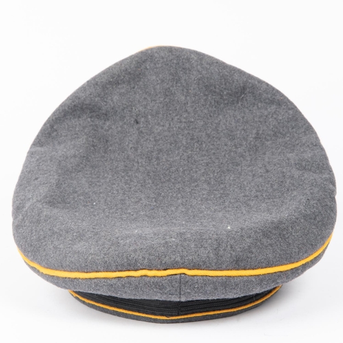 136 - A Third Reich Luftwaffe officer's S.D. cap, with alloy insignia and yellow piping, made by Spohn and... 