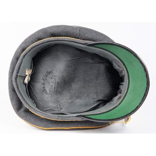 136 - A Third Reich Luftwaffe officer's S.D. cap, with alloy insignia and yellow piping, made by Spohn and... 