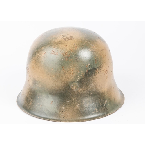 138 - A Third Reich M43 steel helmet, camouflaged finish, SS decal, lining possibly later replacement. GC ... 