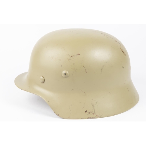 139 - A Third Reich M36 steel helmet, no decals, light grey/green finish, lining possibly post war. VGC £1... 