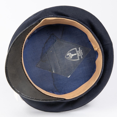 148 - A Third Reich Veterans Association peaked cap, alloy insignia, trade label in lining marked 