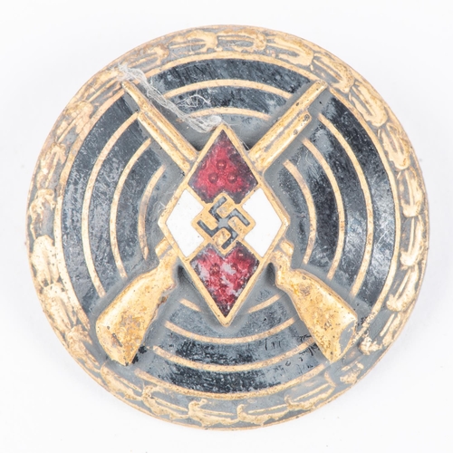 162 - A Third Reich Hitler Youth armband, red and white with overlaid panel; also an enamel shooting badge... 