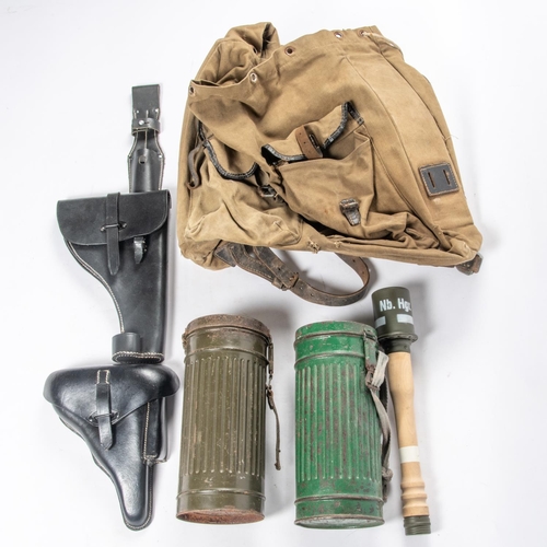 191 - A Third Reich Mountain Troops rucksack, 2 respirator canisters; 2 post war black leather Luger holst... 