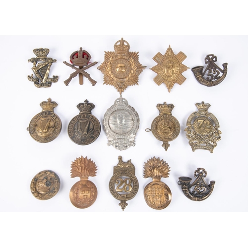 352 - A Victorian post 1881 glengarry badge of the Royal Irish Rifles (top of the orb missing); a Victoria... 